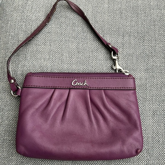 Coach Handbags - Coach purple leather wristlet (used)